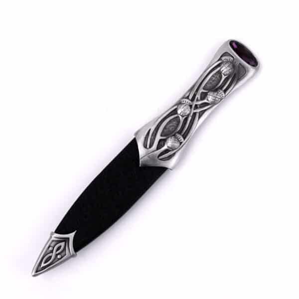 A black and silver Pewter Scottish Thistle Knot Sgian Dubh with an ornate design.