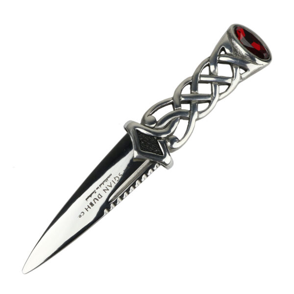 A Pewter Celtic Knot Sgian Dubh with a red stone on it.
