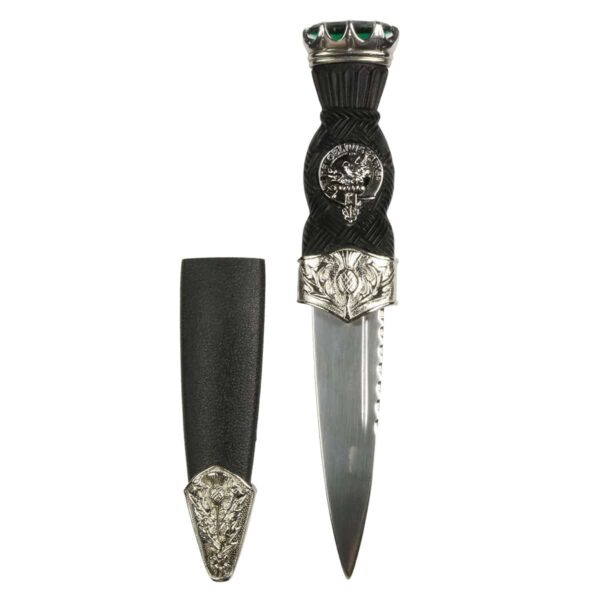 A Thistle Mount Clan Crest Sgian Dubh with a black handle and emeralds on it.