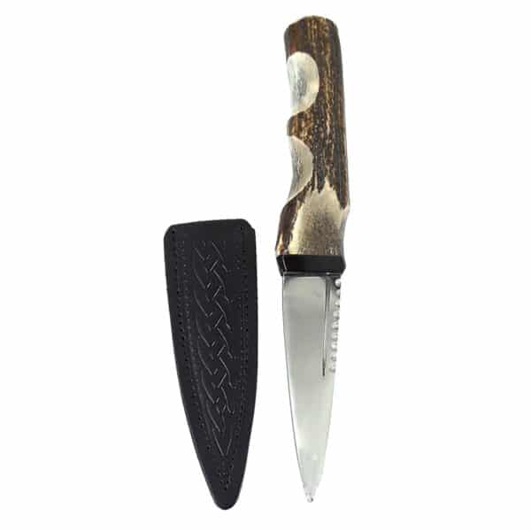 A Stag Handle Sgian Dubh with a leather sheath.