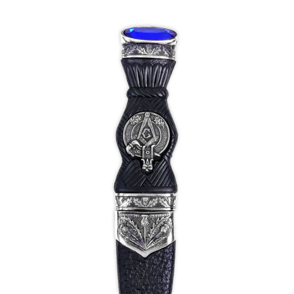 A black and silver kilt with a blue stone, adorned with a Masonic Sgian Dubh.