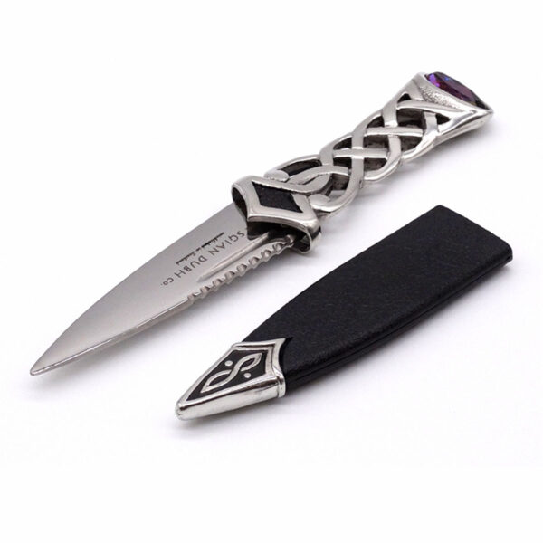 A Pewter Celtic Knot Sgian Dubh with a purple handle.