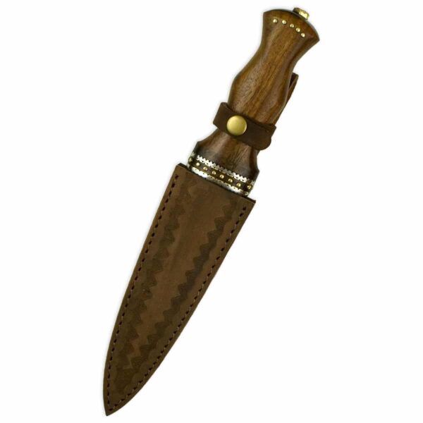 A Damascus Dirk With Ornate Rosewood Handle with an ornate rosewood handle on a white background.