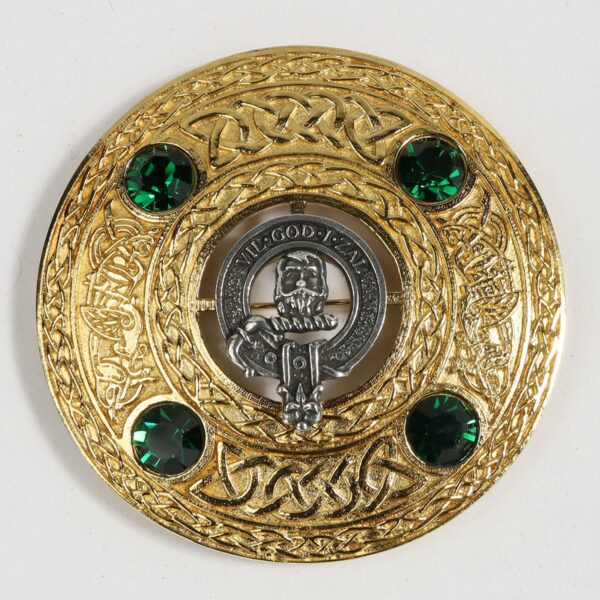 A scottish kilt badge with emerald stones.