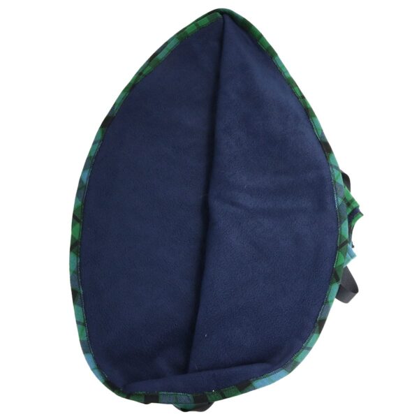 A blue and green plaid pillow on a MacKay Ancient - Tartan Tree Skirt - Homespun Wool Blend.