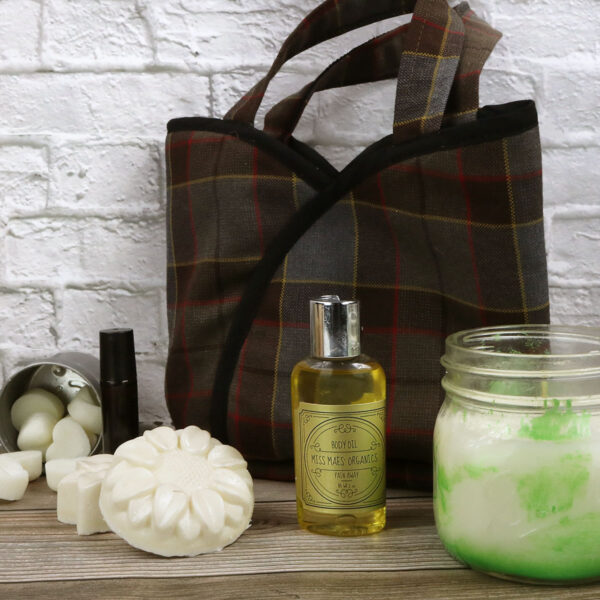 Poly/Viscose Wool-Free Scottish tartan tote bag with candles and jars.
