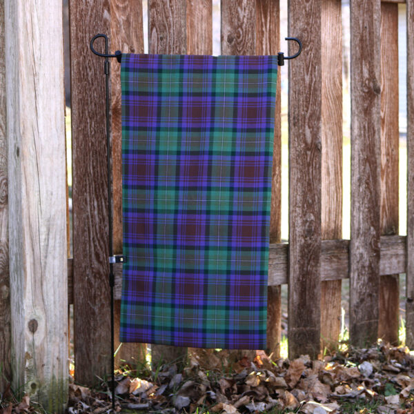 Tartan Garden Flag - Homespun Wool Blend hanging from a wooden fence.